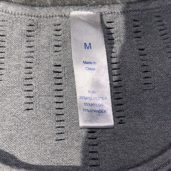 This is a workout shirt, size medium color is grey and black. - Picture 2 of 4